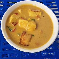A picture of Paneer Corn Capsicum Sabji in Yellow Gravy.