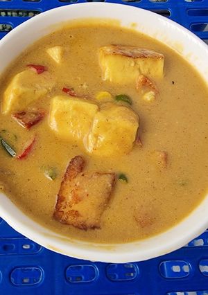 A picture of Paneer Corn Capsicum Sabji in Yellow Gravy.