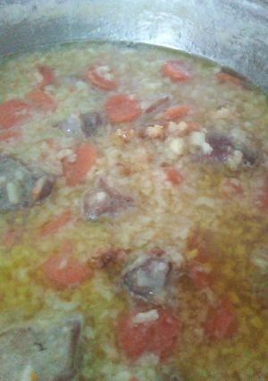 Una foto de Paella pavo y verduras