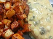Una foto de pechugas de pollo con queso crema