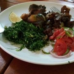 A picture of Dry fry beef and sauted kale.
