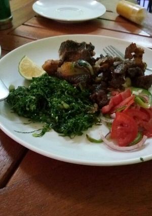 A picture of Dry fry beef and sauted kale.