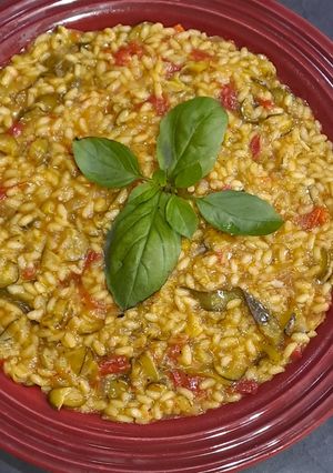 A picture of Spanish Saffron Risotto with Zucchini and Sundried Tomatoes.