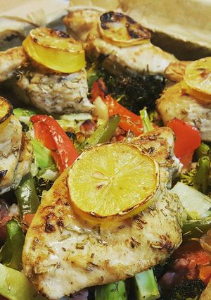 A picture of Baked lemon and herb chicken and veges.
