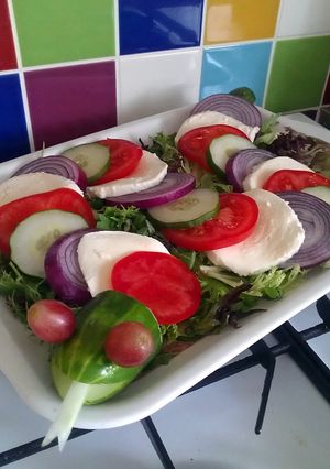 A picture of Vickys Halloween Cucumber 'Caprese' Snake Salad, GF DF EF SF NF.