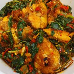 A picture of Fried fish with vegetable sauce.