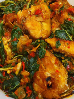 A picture of Fried fish with vegetable sauce.