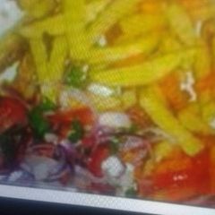 A picture of Chips with kachumbari.