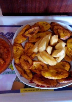 A picture of Fried plantain/Sweet potatoe with Stew.