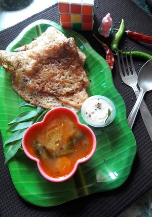 A picture of Vermicelli dosa with sambhar chutney.