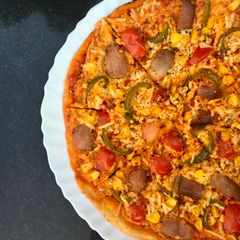 A picture of Thin crust veggie pizza.