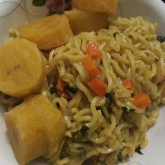 A picture of Indomine with carrots and boiled plantain.