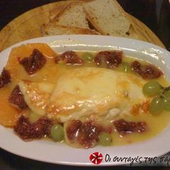 A picture of Halloumi with an orange dressing.