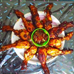 A picture of Chicken Drumsticks in Schezwan Sauce.