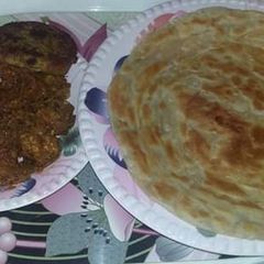 A picture of Puri paratha in tawa style.