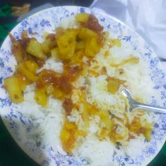A picture of White Rice with Potato Salan.