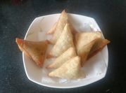A picture of minced meat spring onion samosas