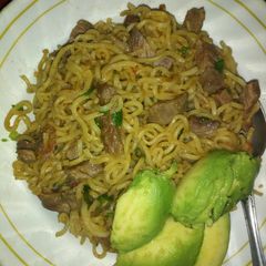 A picture of Fried meat with noodles.