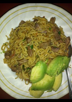 A picture of Fried meat with noodles.