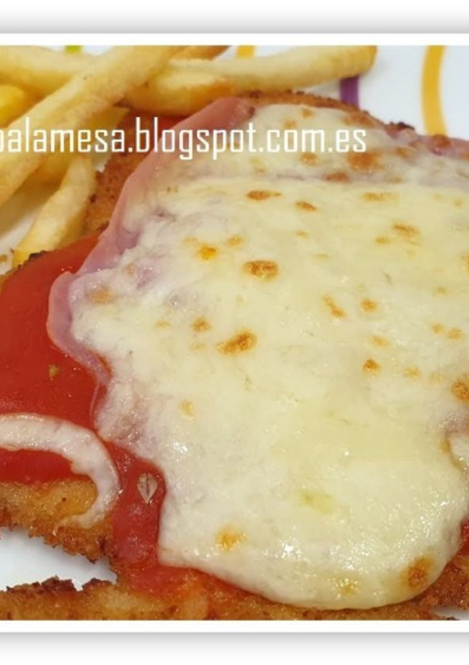 Una foto de Milanesa de pollo napolitana