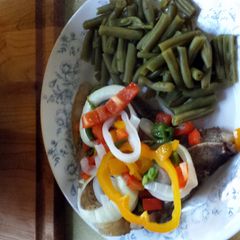 A picture of Baked T Bone and veggies.