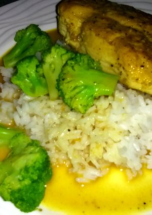 A picture of Dijon chicken with rice and steamed broccoli.