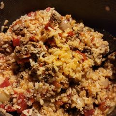 A picture of Spanish rice with ground beef.