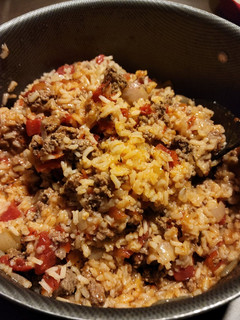 A picture of Spanish rice with ground beef.