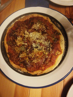 Una foto de Pizza en horno de leña
