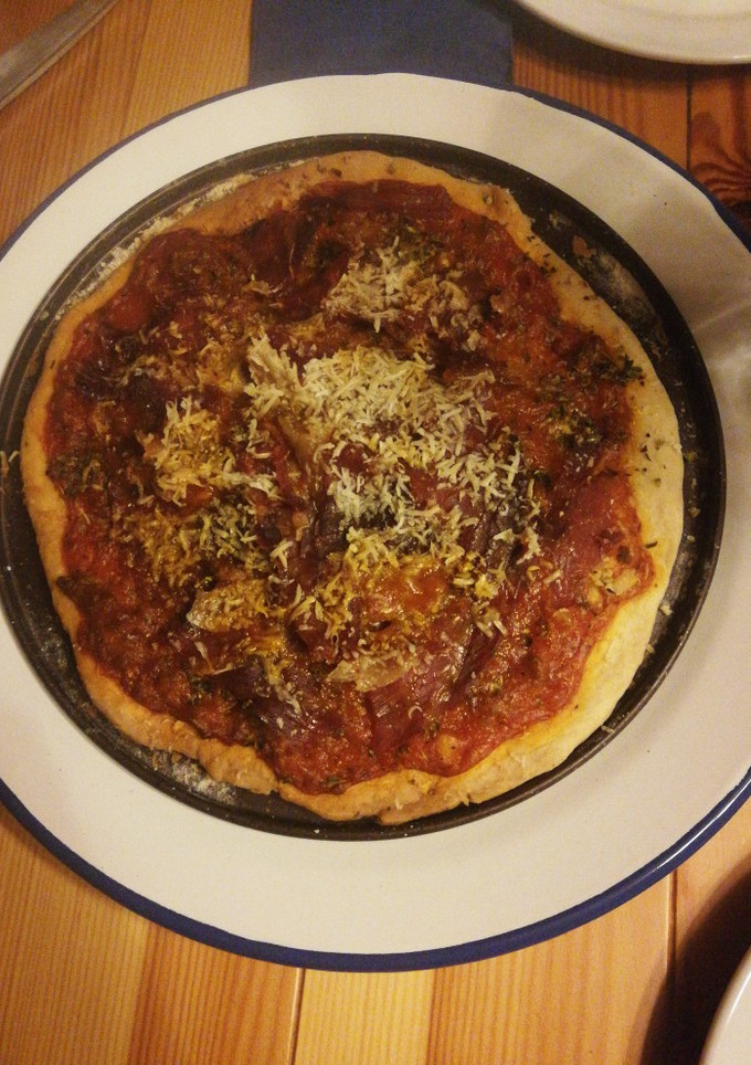 Una foto de Pizza en horno de leña