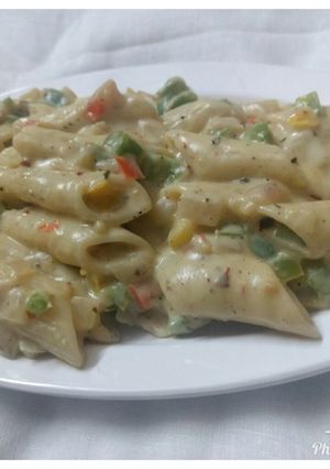 A picture of Pasta in white sauce.