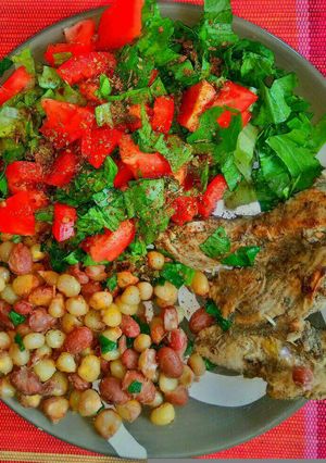 A picture of Githeri and Grilled chicken.