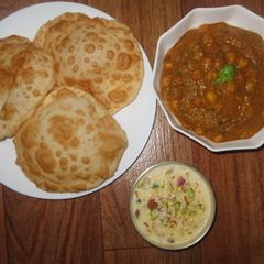 A picture of Chole bhatura with Rice kheer.