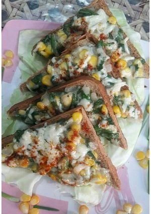 A picture of Spinach corn cheese toast.