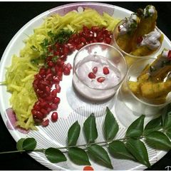 A picture of Steamed pumpkin fritters with pomegranate curd dip.