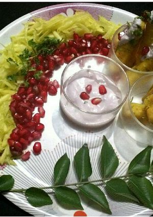 A picture of Steamed pumpkin fritters with pomegranate curd dip.