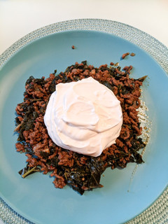 A picture of Kale with minced beef and garlic yogurt sauce.