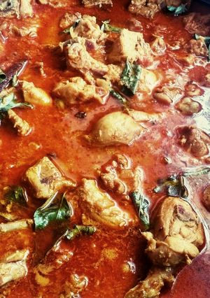 A picture of Tomato chicken curry.