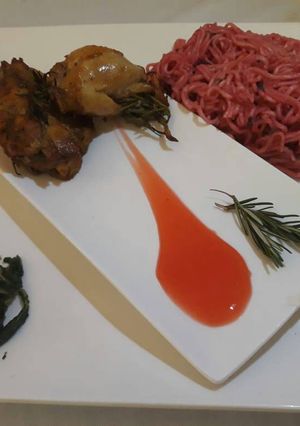 A picture of Rosemary chicken with spicy noodles and saute spinach.