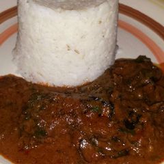 A picture of White rice with Banga stew.