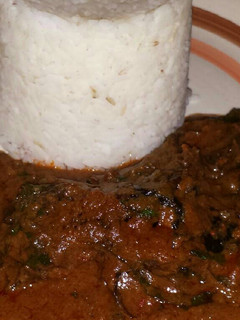 A picture of White rice with Banga stew.