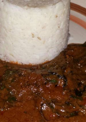 A picture of White rice with Banga stew.