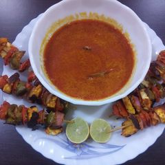 A picture of Paneer tikka with gravy.