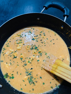 A picture of Paneer in rich cashew tomato gravy.