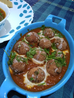 A picture of Paneer Koftas in Tomato Gravy.