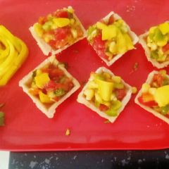 A picture of Mango salsa appetizer bites.