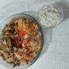 A picture of Mutton mince masor polaw with boondi raita.