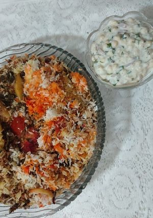 A picture of Mutton mince masor polaw with boondi raita.
