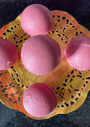 A picture of Pink tea chocolate bombs.