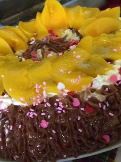 Una foto de Torta de durazno y dulce de leche